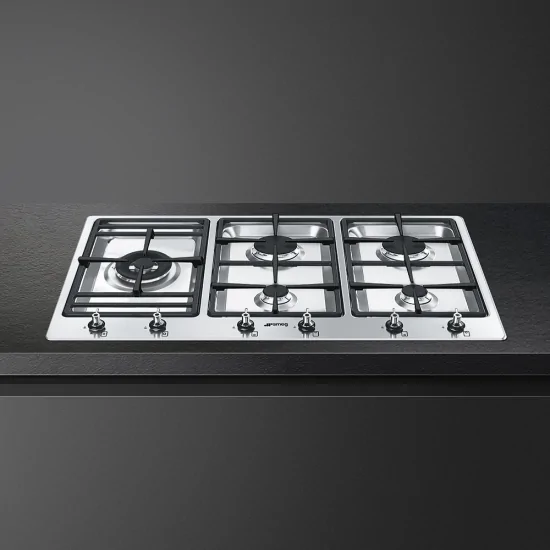 Elevate your culinary style with Smeg: Discover the versatility of the 90 cm PS906-5 built-in semi-flush hob.