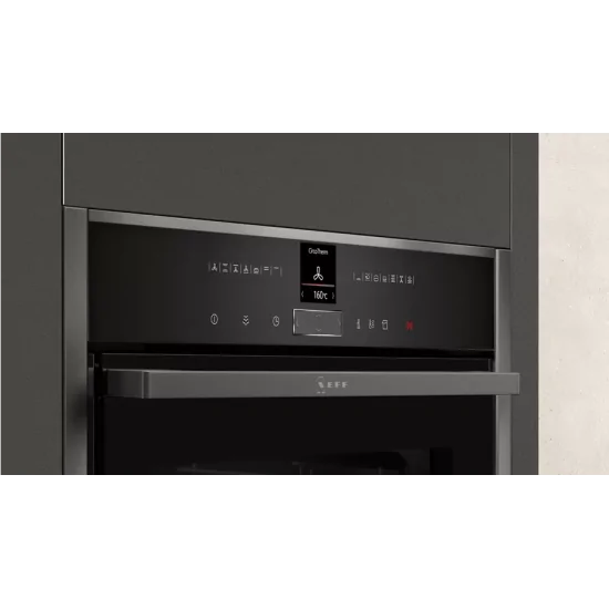 Neff Vario Steam: Diapositiva del horno eléctrico Hide® en Graphite Grey.